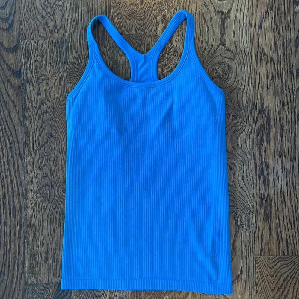 Lululemon Ebb to Street Tank, size 8, Turquoise with built in bra.